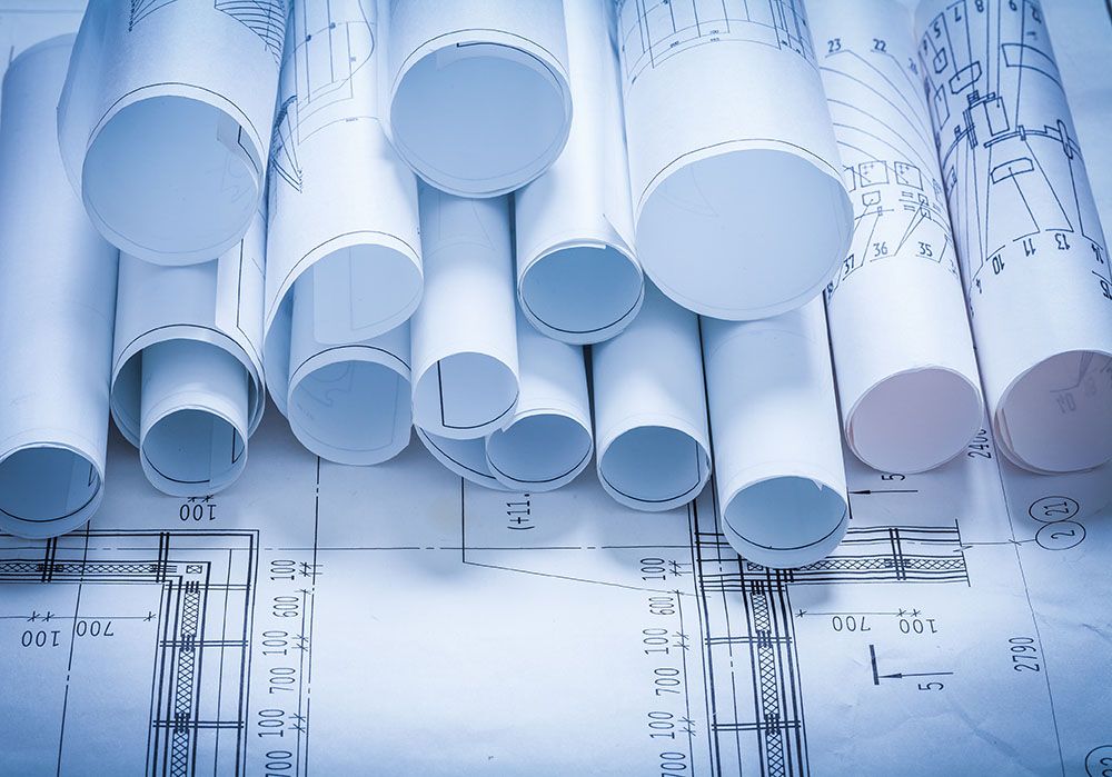 Composition of blueprint rolls construction concept